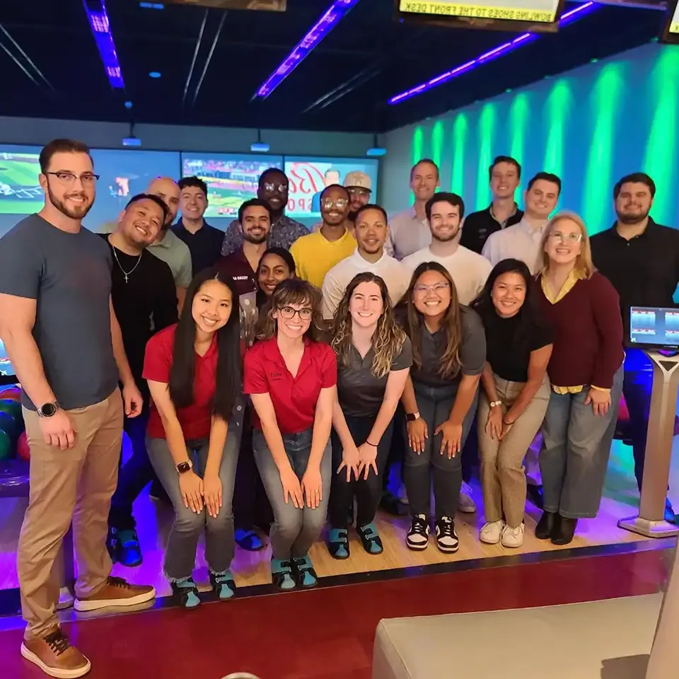 Wood employees pictured at a bowling alley